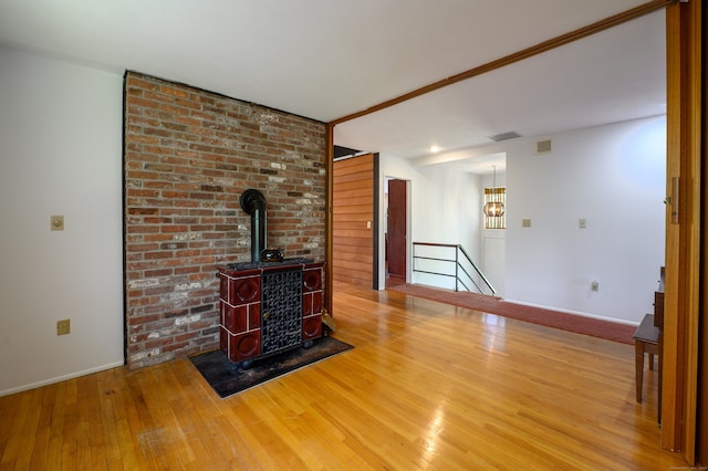 87 Pleasant Dr, Bethany, CT 06524 - unfurnished living room with wood finished floors and a wood stove
