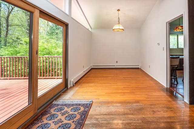 87 Pleasant Dr, Bethany, CT 06524 - unfurnished room with a baseboard heating unit, light wood finished floors, and vaulted ceiling