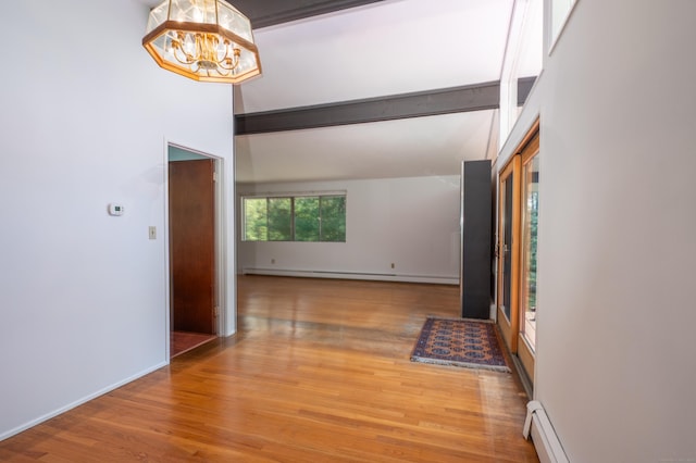 87 Pleasant Dr, Bethany, CT 06524 - hallway featuring a baseboard heating unit, a chandelier, light wood-type flooring, and a baseboard radiator