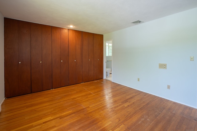 87 Pleasant Dr, Bethany, CT 06524 - unfurnished bedroom with wood finished floors and ensuite bathroom