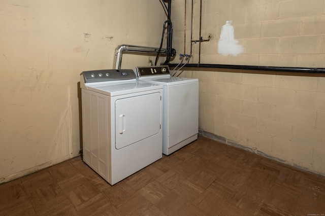 87 Pleasant Dr, Bethany, CT 06524 - laundry area with washing machine and clothes dryer and concrete block wall