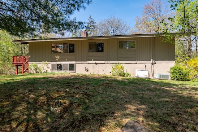 87 Pleasant Dr, Bethany, CT 06524 - rear view of house with a chimney, a yard, a wooden deck, and stairs