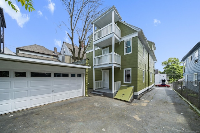 220 Hillside Ave, Waterbury, CT 06710 - view of front of house with a balcony, driveway, and a garage