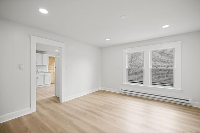 220 Hillside Ave, Waterbury, CT 06710 - empty room with a baseboard radiator, light wood-type flooring, and recessed lighting