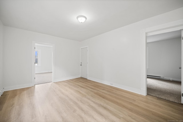 220 Hillside Ave, Waterbury, CT 06710 - empty room with light wood-style floors and baseboard heating