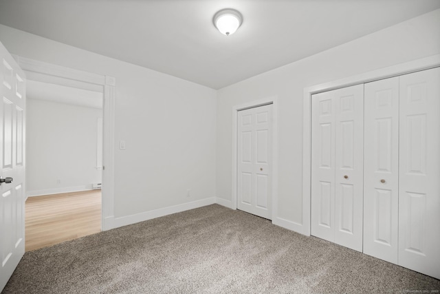 220 Hillside Ave, Waterbury, CT 06710 - unfurnished bedroom featuring carpet flooring and two closets