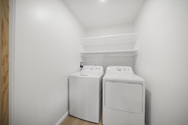 220 Hillside Ave, Waterbury, CT 06710 - laundry room featuring separate washer and dryer and light wood-type flooring