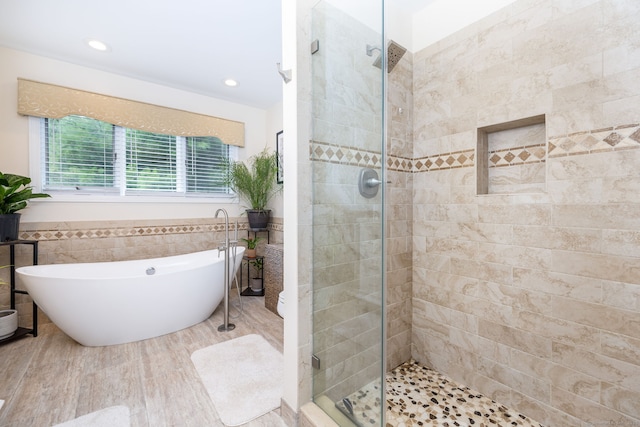 89 Honey Hill Rd, New Hartford, CT 06057 - bathroom with a shower stall, a soaking tub, tile walls, recessed lighting, and wainscoting