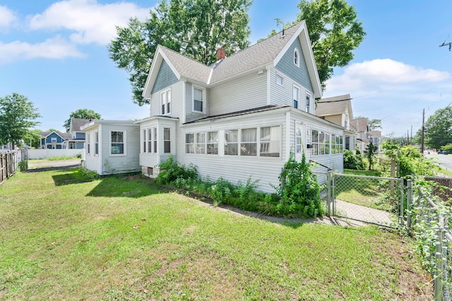 53 Wells Ave, East Hartford, CT 06108 - back of house with a gate, a chimney, and a shingled roof