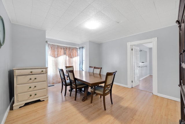 53 Wells Ave, East Hartford, CT 06108 - dining area featuring light wood finished floors and ornamental molding