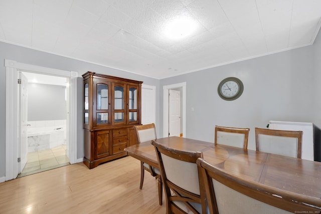 53 Wells Ave, East Hartford, CT 06108 - dining room with ornamental molding and light wood-style floors