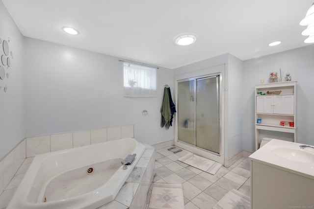 53 Wells Ave, East Hartford, CT 06108 - bathroom with a jetted tub, a stall shower, vanity, and tile patterned floors