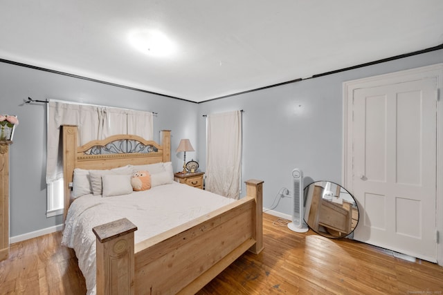 53 Wells Ave, East Hartford, CT 06108 - bedroom with baseboards and wood finished floors