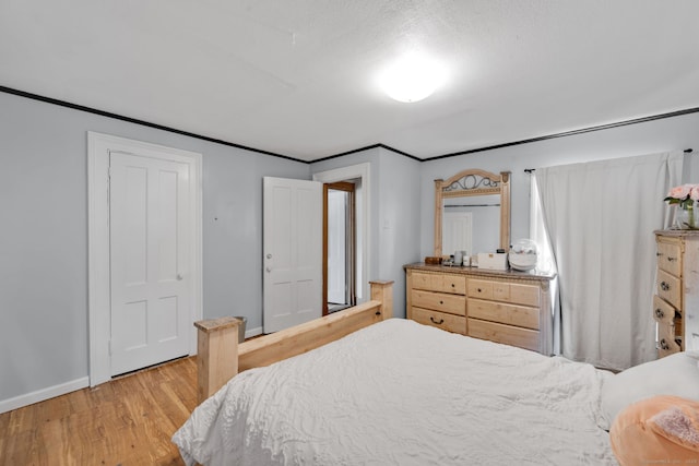 53 Wells Ave, East Hartford, CT 06108 - bedroom with wood finished floors and ornamental molding