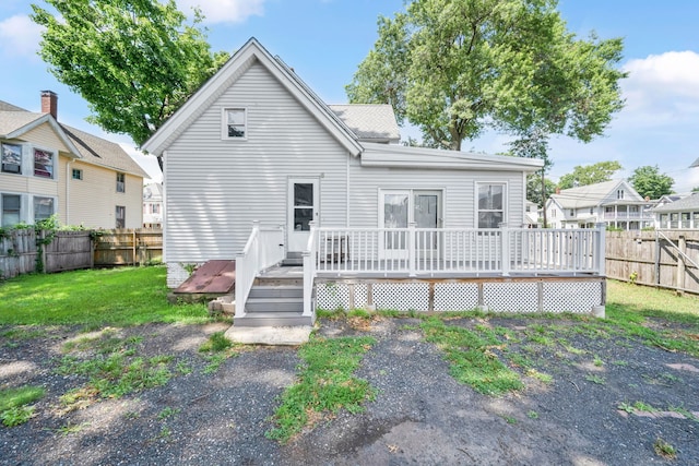 53 Wells Ave, East Hartford, CT 06108 - rear view of property with a fenced backyard and a wooden deck