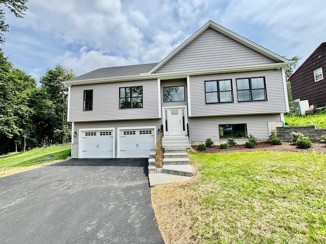 2 Gary Knls, Danbury, CT 06810 - bi-level home with an attached garage, asphalt driveway, and a front lawn
