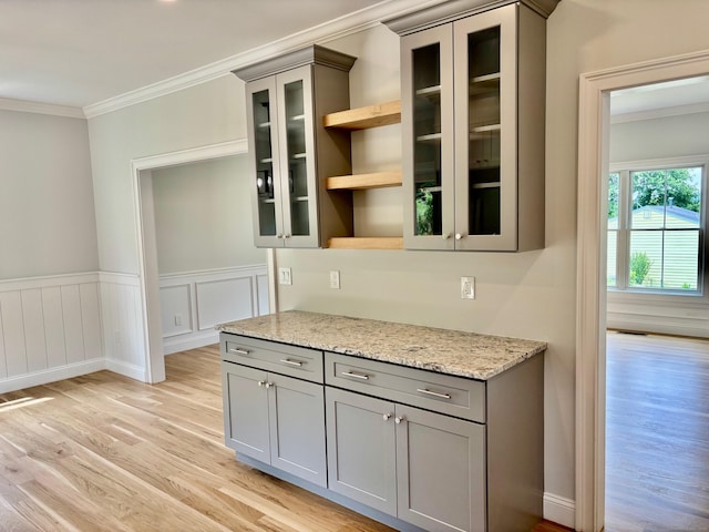 2 Gary Knls, Danbury, CT 06810 - kitchen featuring gray cabinets, light wood finished floors, ornamental molding, open shelves, and glass insert cabinets
