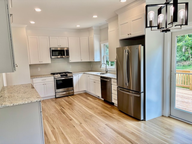 2 Gary Knls, Danbury, CT 06810 - kitchen with stainless steel appliances, light wood-style floors, light stone countertops, recessed lighting, and white cabinetry