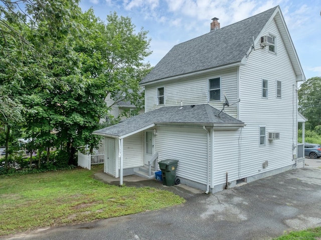 17 Walden Ave, New London, CT 06320 - view of property exterior with roof with shingles, a chimney, entry steps, and a wall mounted AC