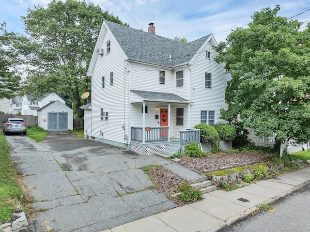 17 Walden Ave, New London, CT 06320 - view of front of property featuring a porch, roof with shingles, a chimney, a storage shed, and asphalt driveway