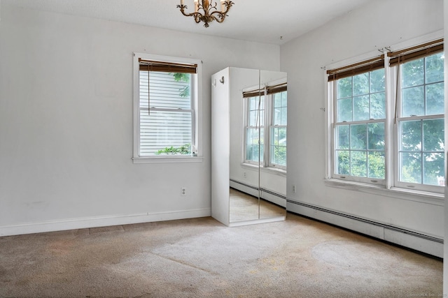 17 Walden Ave, New London, CT 06320 - carpeted spare room with plenty of natural light, a chandelier, and baseboard heating