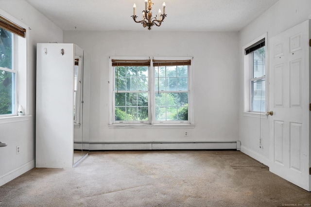 17 Walden Ave, New London, CT 06320 - unfurnished dining area featuring a baseboard heating unit, carpet floors, and a chandelier