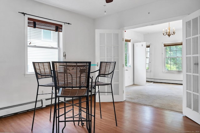 17 Walden Ave, New London, CT 06320 - dining area featuring baseboard heating, plenty of natural light, and a chandelier