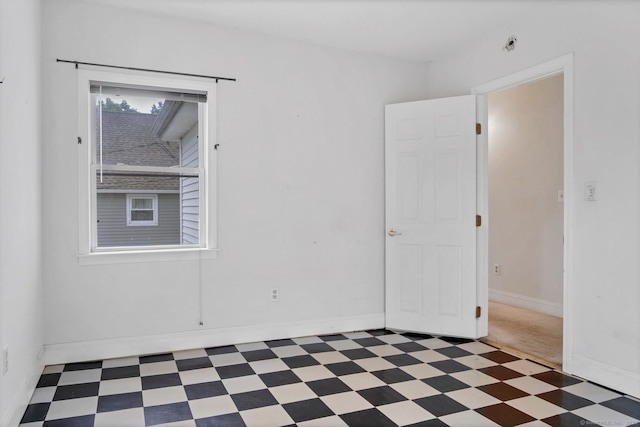 17 Walden Ave, New London, CT 06320 - spare room featuring tile patterned floors and baseboards