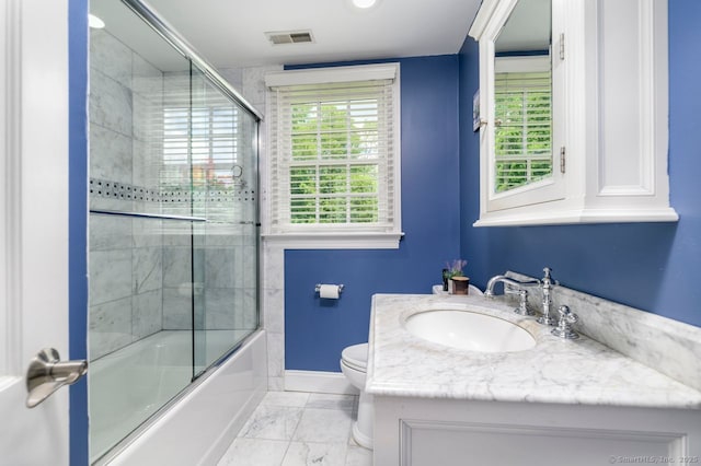 285 Westover Rd, Stamford, CT 06902 - bathroom featuring vanity, combined bath / shower with glass door, and marble look tiles