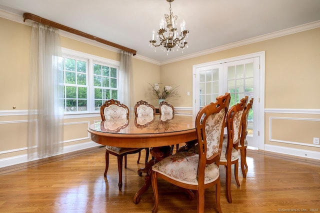 285 Westover Rd, Stamford, CT 06902 - dining space with a chandelier, light wood finished floors, and crown molding