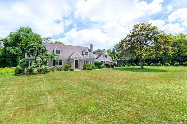 285 Westover Rd, Stamford, CT 06902 - new england style home with a chimney and a front yard