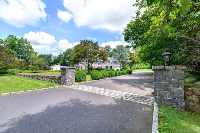 285 Westover Rd, Stamford, CT 06902 - view of asphalt driveway featuring street lighting