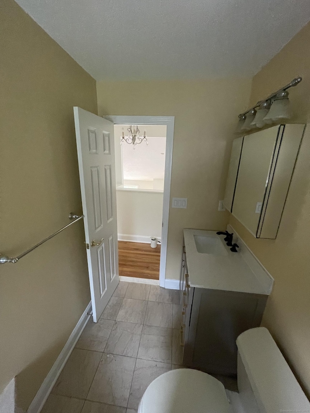 37 W Normandy Dr, West Hartford, CT 06107 - half bathroom featuring vanity, marble finish flooring, and a textured ceiling