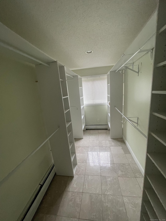 37 W Normandy Dr, West Hartford, CT 06107 - spacious closet featuring baseboard heating and tile patterned floors