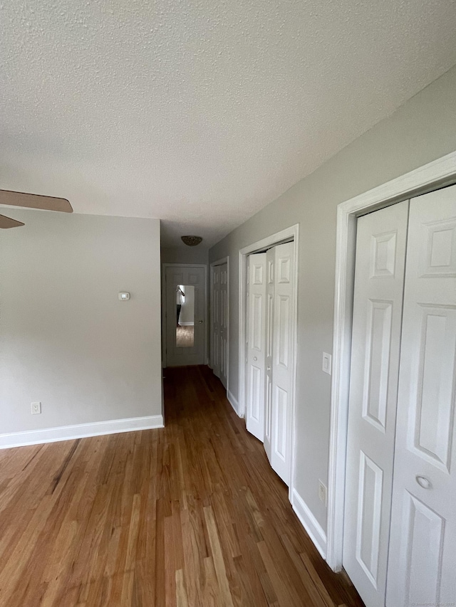 37 W Normandy Dr, West Hartford, CT 06107 - corridor featuring wood finished floors and a textured ceiling