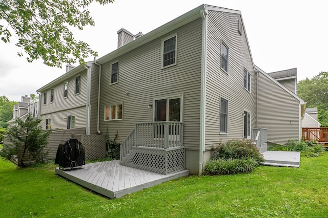 29 S Village Rd Unit 29, Branford, CT 06405 - rear view of house with a deck, a yard, and a chimney
