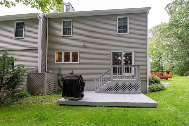 29 S Village Rd Unit 29, Branford, CT 06405 - back of house with a deck, a lawn, and a chimney