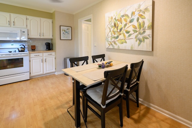 29 S Village Rd Unit 29, Branford, CT 06405 - dining room with light wood-style floors and ornamental molding