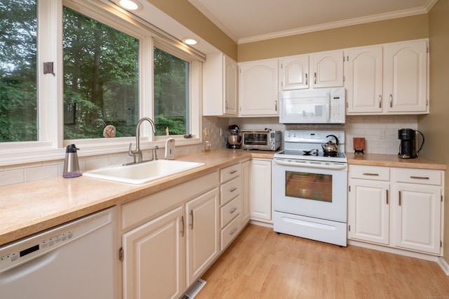 29 S Village Rd Unit 29, Branford, CT 06405 - kitchen with white appliances, crown molding, decorative backsplash, and light countertops