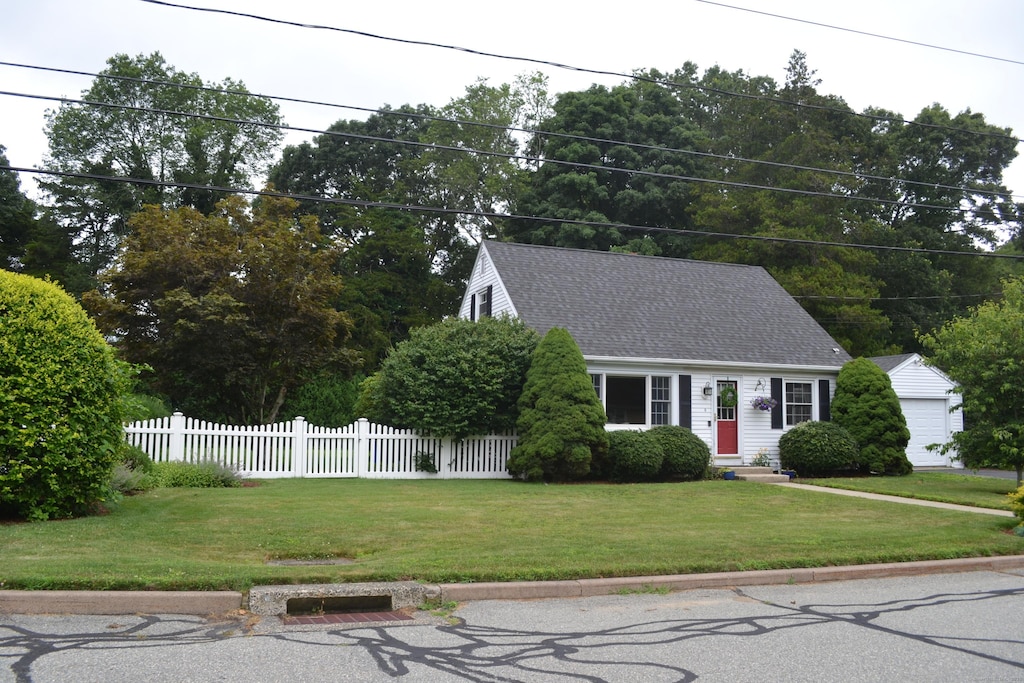 8 Deborah St, Waterford, CT 06385 - cape cod-style house with a shingled roof and an outbuilding