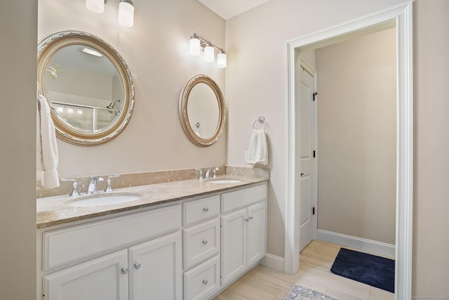7 Still Water Cir Unit 7, Brookfield, CT 06804 - bathroom with double vanity and baseboards