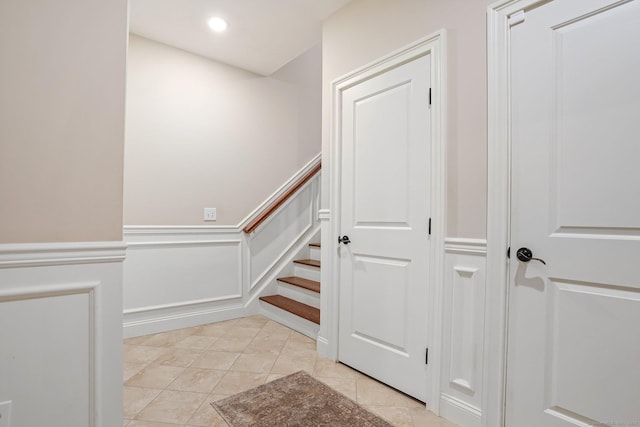 7 Still Water Cir Unit 7, Brookfield, CT 06804 - stairs featuring a decorative wall, tile patterned flooring, wainscoting, and recessed lighting