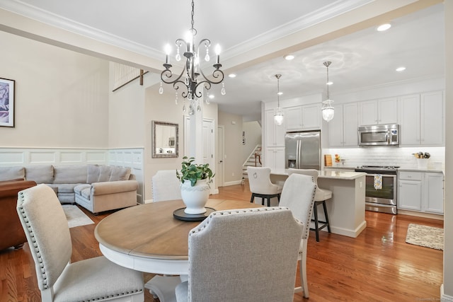 7 Still Water Cir Unit 7, Brookfield, CT 06804 - dining area featuring ornamental molding, light wood finished floors, a chandelier, recessed lighting, and stairs