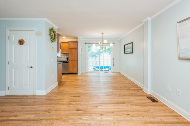 38 Stuart Ave Apt C, Norwalk, CT 06850 - unfurnished dining area with a chandelier, light wood-style flooring, and crown molding
