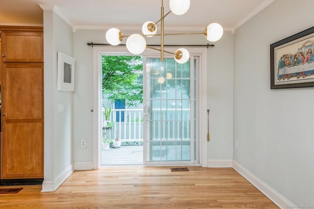 38 Stuart Ave Apt C, Norwalk, CT 06850 - doorway to outside featuring ornamental molding, light wood finished floors, and a chandelier