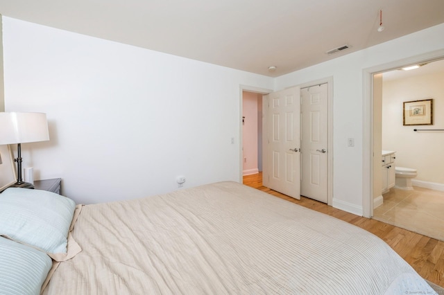38 Stuart Ave Apt C, Norwalk, CT 06850 - bedroom with light wood finished floors and connected bathroom
