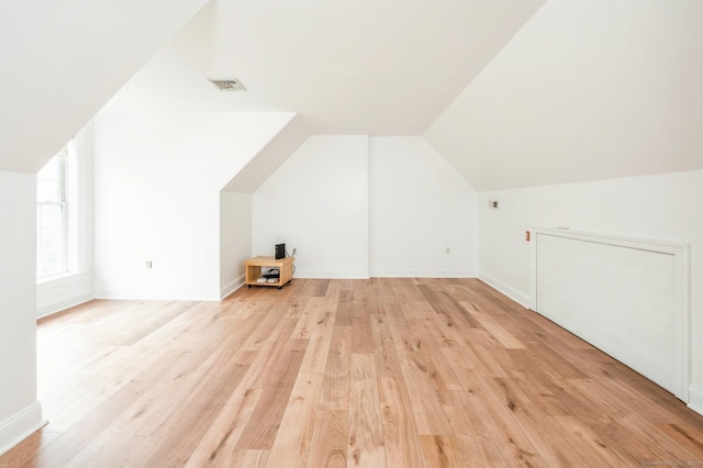 38 Stuart Ave Apt C, Norwalk, CT 06850 - bonus room featuring light wood-style flooring and vaulted ceiling