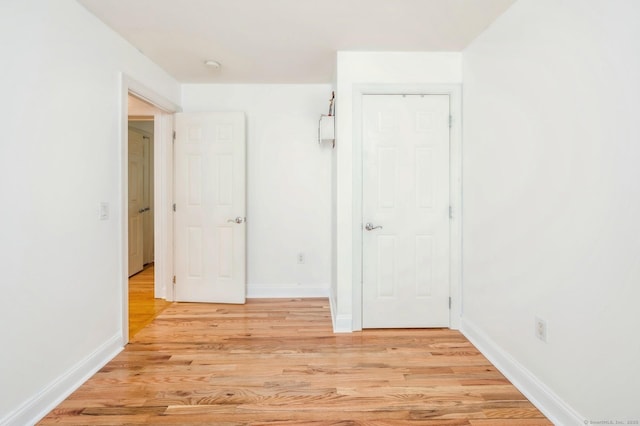 38 Stuart Ave Apt C, Norwalk, CT 06850 - hallway featuring light wood finished floors and baseboards