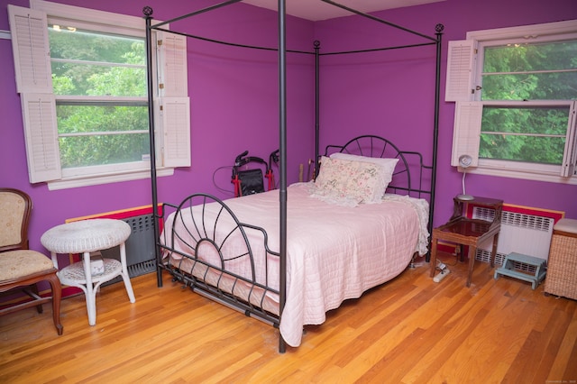 780 Ridge Rd, Hamden, CT 06517 - bedroom with radiator heating unit and wood finished floors
