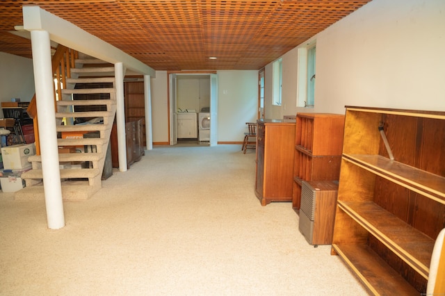 780 Ridge Rd, Hamden, CT 06517 - finished below grade area featuring washing machine and clothes dryer, light carpet, and stairway